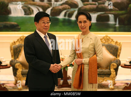 Nay Pyi Taw, Myanmar. 9th May, 2018. Visiting Chinese State Councilor and Minister of Public Security Zhao Kezhi (L) shakes hands with Myanmar State Counselor Aung San Suu Kyi in Nay Pyi Taw, Myanmar, on May 9, 2018. Credit: U Aung/Xinhua/Alamy Live News Stock Photo