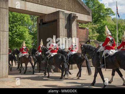 Hyde Park Barracks, London, UK. 9 May, 2018. Behind-the-scenes ‘Day in the Life of the Household Cavalry Mounted Regiment’. Prince Harry joined The Blues and Royals in April 2006 and served with the Household Cavalry Regiment, undertaking two tours of Afghanistan and rising to the rank of Captain. Photo: After daily inspection Life Guards ride out for Changing the Guard ceremony at Horse Guards Parade. Credit: Malcolm Park/Alamy Live News. Stock Photo