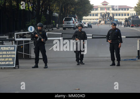 Depok, Indonesia. 9th May, 2018. Officers stand guard outside the headquarters of Mobile Brigade, an elite Indonesian police forces, following a riot at the detention center inside the compound in Depok, West Java, Indonesia, on May 9, 2018. Militants killed five members of an anti-terror squad and is taking another hostage in a prison riot in the outskirts of the capital Jakarta, police said on Wednesday. Credit: Agung Kuncahya B./Xinhua/Alamy Live News Stock Photo