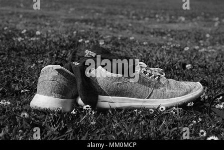 shoes on grass in black and white Stock Photo