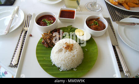 PULAU LANGKAWI, MALAYSIA - APR 4th 2015: Nasi Lemak, a traditional Malay sambal curry paste rice dish. It is commonly found food in Malaysia, Brunei a Stock Photo