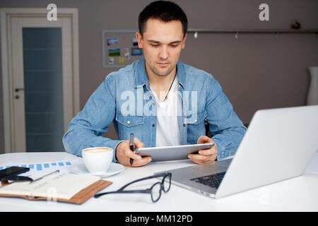Man working from home on his laptop Stock Photo