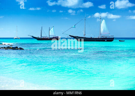 Arashi Beach, Aruba, Caribbean Sea: 2 tour boats anchored for tourists to go swimming or snorkeling in the turquoise water. Stock Photo