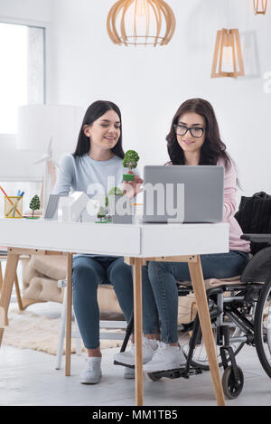 woman is fixing a wheelchair Stock Photo - Alamy