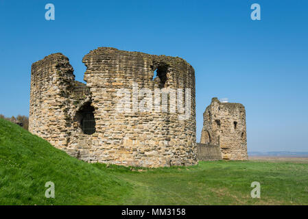 Ruins of Flint Castle beside the river Dee in Flintshire, North Wales. Circular 'Donjon' tower in the foreground. Stock Photo