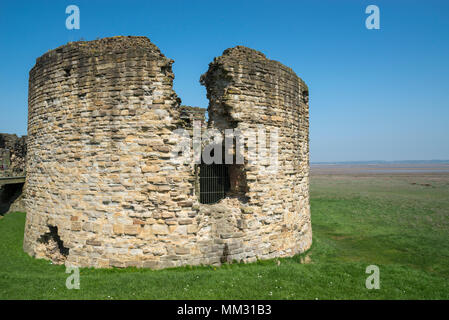 Ruins of Flint Castle beside the river Dee in Flintshire, North Wales. the circular 'Donjon' tower. Stock Photo