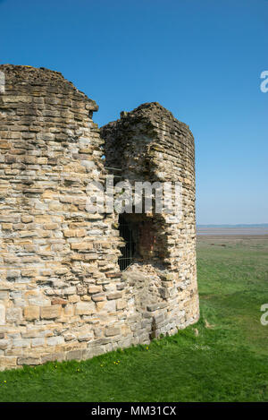 Ruins of Flint Castle beside the river Dee in Flintshire, North Wales. the circular 'Donjon' tower. Stock Photo