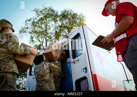 Jim Pierer right a volunteer with the American Red Cross watches