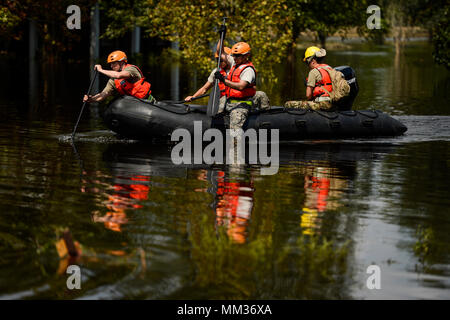 Texas National Guard Soldiers with the 551st Multi-Role Bridge Company out of El Campo, Texas search for flooded neighborhoods in Orange, Texas to patrol with their boats, Sept. 3, 2017. Hurricane Harvey formed in the Gulf of Mexico and made landfall in southeastern Texas, bringing record flooding and destruction to the region. (U.S. Air Force photo by Master Sgt. Joshua L. DeMotts) Stock Photo