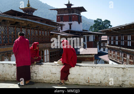 Monks relaxing at monastery, Dzong, Trongsa, Bhutan Stock Photo