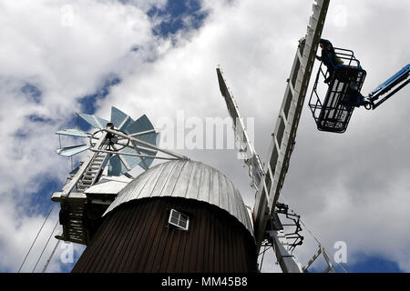 A new sail is fitted to Wicken Village windmill in Cambridgeshire. Stock Photo