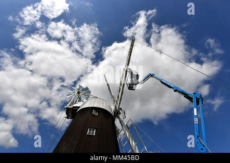 A new sail is fitted to Wicken Village windmill in Cambridgeshire. Stock Photo