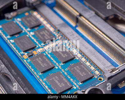 installing memory. Laptop RAM upgrade. Stock Photo