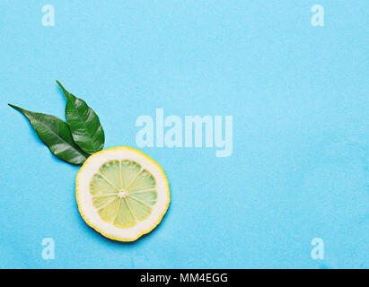 Sliced lemon on blue background Stock Photo