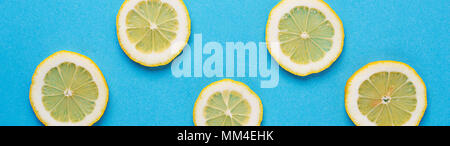 Sliced lemon on blue background Stock Photo