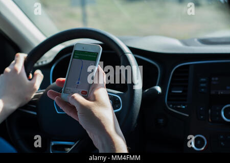 Using mobile phone in car Stock Photo