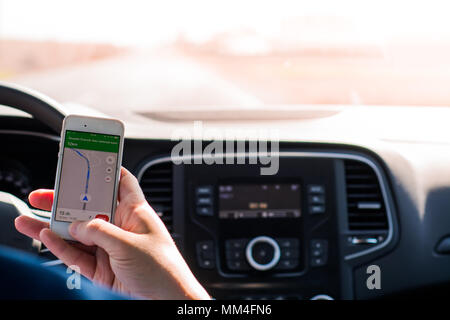 Using mobile phone in car Stock Photo