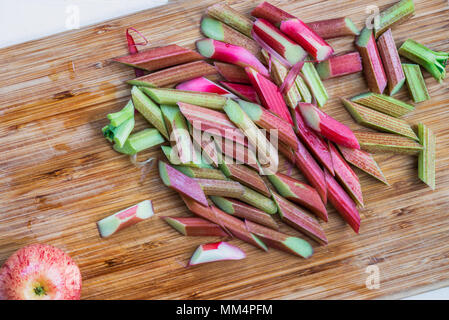 Ingredients for homemade rhubarb and apple crumble on the chopping board Stock Photo