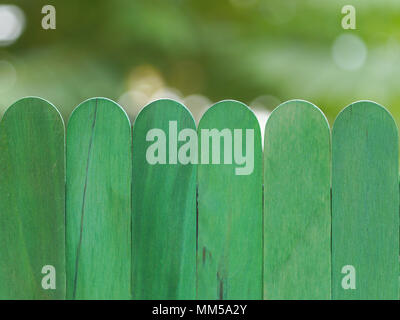 green wooden fence against bokeh  background Stock Photo