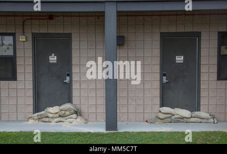 Sandbags are placed in front of first deck barracks room doors aboard MCAS, Beaufort, S.C., Sept., 10, 2017.  Sandbags are placed to minimize damage in preparation of impacts caused by Hurricane Irma. (U.S. Marine Corps photo by Lance Cpl. Erin R. Ramsay/ Released) Stock Photo