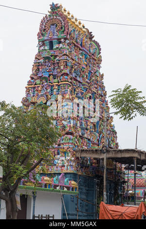The highly colorful ornate entrance, or Gopuram, of the Vedapureeeswarar Hindu temple in the former French colony of Pondicherry in Tamil Nadu. Stock Photo