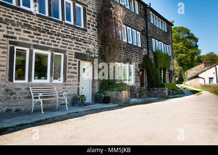 Location of Clegg and Howards home in last of the summer wine, white and brown doors white window frames, stone built house. Stock Photo