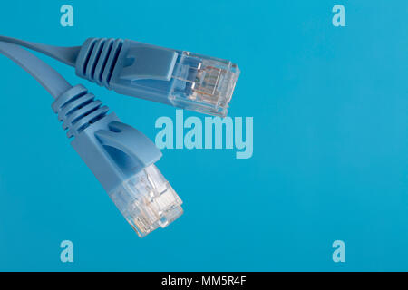 Telecommunication cable with blue RJ45 plug Stock Photo