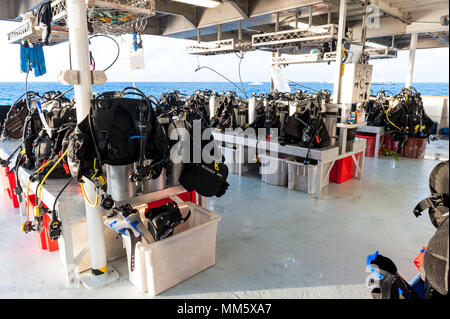 Scuba diving gear on the deck of a live aboard boat ready for the next dive on The Great Barrier Reef Australia. Stock Photo