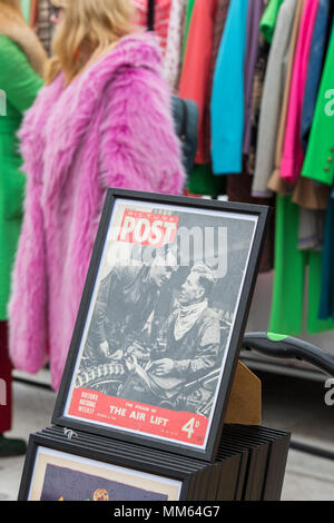 Framed picture post magazine in front of vintage womens clothing rack at a retro vintage car boot sale. Granary Square, Kings Cross, London Stock Photo