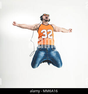 emotional and charming guy - rapper in headphones takes the danc Stock Photo