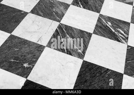 Marble floor tiling with classical black and white checkered pattern Stock Photo
