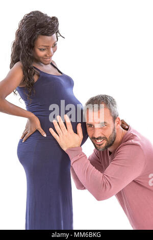 Man listening the belly of pregnant woman Stock Photo - Alamy