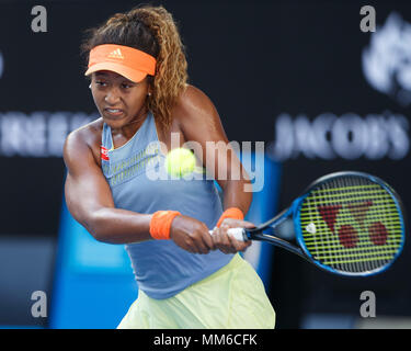 Japanese tennis player Naomi Osaka playing backhand shot in Australian Open 2018 Tennis Tournament, Melbourne Park, Melbourne, Victoria, Australia. Stock Photo