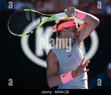 Spanish tennis player Rafael Nadal  playing forehand shot in Australian Open 2018 Tennis Tournament, Melbourne Park, Melbourne, Victoria, Australia. Stock Photo