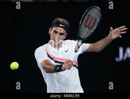 Swiss tennis player Roger Federer playing backhand shot in Australian Open 2018 Tennis Tournament, Melbourne Park, Melbourne, Victoria, Australia. Stock Photo