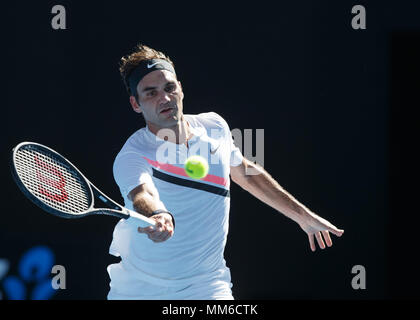 Swiss tennis player Roger Federer playing forehand shot in Australian Open 2018 Tennis Tournament, Melbourne Park, Melbourne, Victoria, Australia. Stock Photo