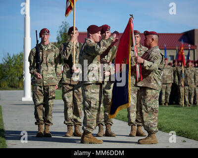 U.S. Army Col. Jason Jones, 4th Brigade Combat Team (Airborne), 25th Infantry Division commander, and Command Sgt. Maj. Robert Duenas, 4/25 IBCT (ABN) command sergeant major, case the unit colors, marking the brigade's release from U.S. Army Alaska and their impending deployment to Afghanistan during a Sept. 8, 2017, ceremony at Joint Base-Elmendorf-Richardson. The colors will be uncased during a separate ceremony Afghanistan, indicating their integration into the international coalition there. (U.S. Air Force photo by David Bedard) Stock Photo