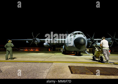 53rd Weather Reconnaissance Squadron operates WC-130J Super Hercules aircraft for tropical cyclone monitoring under Air Force Reserve Command. On September 10, 2017, personnel at Keesler Air Force Base prepared for a Hurricane Irma reconnaissance flight through the storm eye. The archival image documents engine start activity and crew briefing before departure for meteorological sampling. Stock Photo