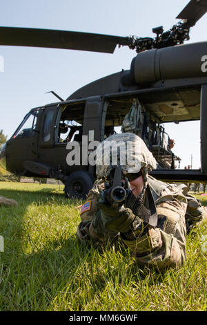 Alabama National Guard 1-173 Infantry Soldiers train to perform a squad attack on an airfield from a Blackhawk UH-60 in Foley, Alabama, on Sept. 9, 2017. Stock Photo