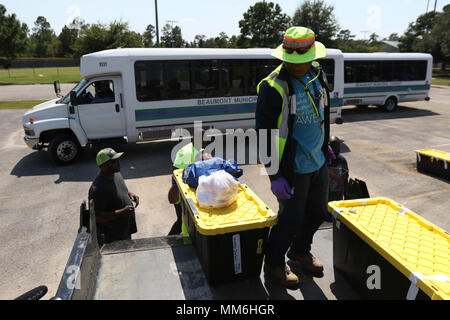 BEAUMONT Beaumont City workers help load the belongings of