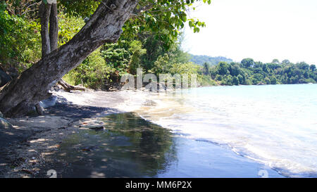 PULAU LANGKAWI, MALAYSIA - APR 7th 2015: Famous black sand beach. Stock Photo