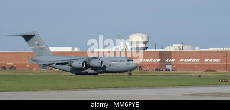 A C-17A Globemaster III from the 445th Airlift Wing, Wright-Patterson Air Force Base, Ohio, Air Force Reserve Command,  rolls down the runway for take-off Sept. 13, 2017, Tinker Air Force Base, Oklahoma. Onboard the aircraft are eight Citizen Airmen from the 35th Combat Communications Squadron and their equipment which are being deployed to Florida as part of the Air Force's Hurricane Irma response and recovery operations. The 35th CBCS deployed servers, radio equipment, power generation and other tools to connect to Department of Defense networks, voice communications and the internet. The 35 Stock Photo