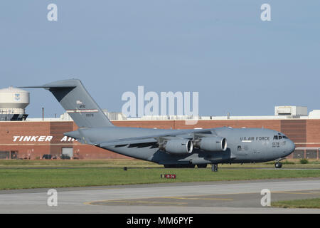 A C-17A Globemaster III from the 445th Airlift Wing, Wright-Patterson Air Force Base, Ohio, Air Force Reserve Command,  rolls down the runway for take-off Sept. 13, 2017, Tinker Air Force Base, Oklahoma. Onboard the aircraft are eight Citizen Airmen from the 35th Combat Communications Squadron and their equipment which are being deployed to Florida as part of the Air Force's Hurricane Irma response and recovery operations. The 35th CBCS deployed servers, radio equipment, power generation and other tools to connect to Department of Defense networks, voice communications and the internet. The 35 Stock Photo