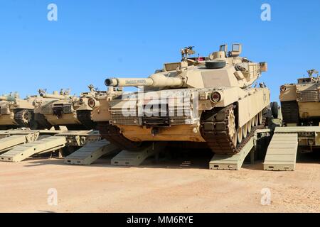 Mohamed Naguib Military Base, Egypt – An M1A2 Abrams Main Battle Tank assigned to Charlie Company, 2nd Battalion,  7th Cavalry Regiment, 3rd Armored Brigade Combat Team, 1st Cavalry Division carefully drives down the ramp of heavy equipment transporter upon its arrival at the field training site for Exercise Bright Star 2017 at Mohamed Naguib Military Base, Egypt, Sept. 9. Bright Star builds on the strategic security relationship between Egypt and the United States, a historic partnership which plays a leading role in counterterrorism, regional security, and efforts to combat the spread of vio Stock Photo