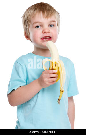 Child kid eating banana fruit healthy blond hair portrait format isolated on a white background Stock Photo