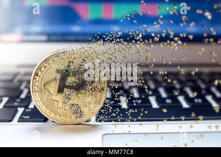 Bitcoin fail concept, Physical golden bitcoin bursting disperse in pieces fragments Stock Photo