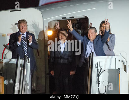 United States President Donald J. Trump welcomes Kim Dong Chul, Kim Hak Song and Tony Kim back to the US at Joint Base Andrews in Maryland on Thursday, May 10, 2018.  The three men were imprisoned in North Korea for periods ranging from one and two years.  They were released to US Secretary of State Mike Pompeo as a good-will gesture in the lead-up to the talks between President Trump and North Korean leader Kim Jong Un. Credit: Ron Sachs / CNP | usage worldwide Stock Photo