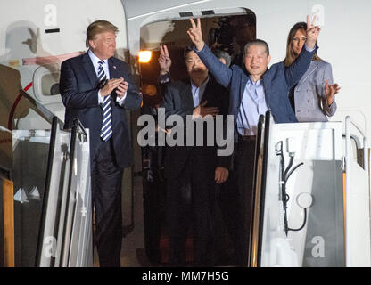 United States President Donald J. Trump welcomes Kim Dong Chul, Kim Hak Song and Tony Kim back to the US at Joint Base Andrews in Maryland on Thursday, May 10, 2018. The three men were imprisoned in North Korea for periods ranging from one and two years. They were released to US Secretary of State Mike Pompeo as a good-will gesture in the lead-up to the talks between President Trump and North Korean leader Kim Jong Un. Credit: Ron Sachs/CNP | usage worldwide Stock Photo