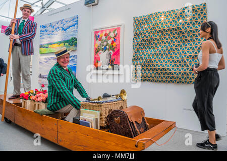 Hampstead, London, UK. 9th May, 2018. A motorised punt entertains on teh opening night - The Affordable Art Fair opens in Hampstead and runs until 14 May. The fair offers visitors a chance to purchase work from over 110 galleries at prices between £100 and £6,000 Credit: Guy Bell/Alamy Live News