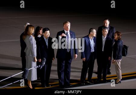 (180510) -- WASHINGTON D.C., May 10, 2018 (Xinhua) -- U.S. President Donald Trump (C) speaks to the media after welcoming Kim Dong-chul, Kim Hak-song and Tony Kim back to the United States at Joint Base Andrews in Washington, DC, the United States, May 10, 2018. Three U.S. citizens that were just freed by the Democratic People's Republic of Korea (DPRK) arrived in Washington early Thursday, as the two countries saw their ties warm up in recent weeks. The three detainees, named Kim Hak-song, Tony Kim, Kim Dong-chul, are all U.S. citizens of Korean descent. They were arrested by DPRK authoritie